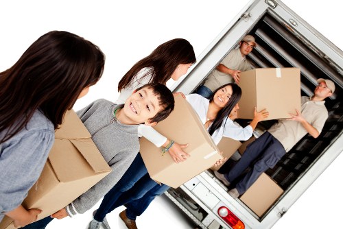 Man and van loading furniture for a Chelsea home move