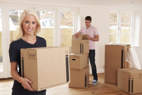 Packed moving boxes and furniture ready for transport