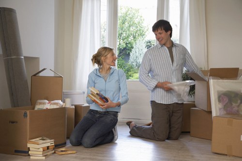 Packed moving boxes and furniture prepared for transport in Chelsea