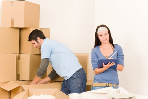 Movers handling desks and IT equipment during a Chelsea office move