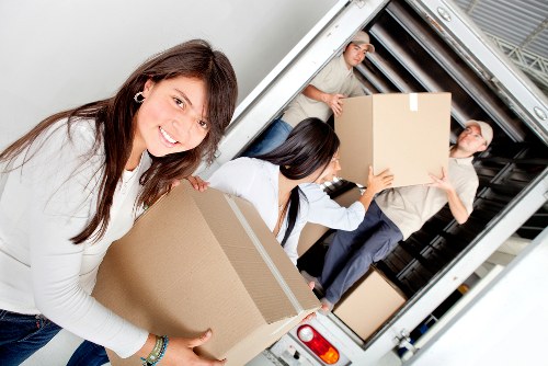 Commercial movers relocating office equipment in Chelsea
